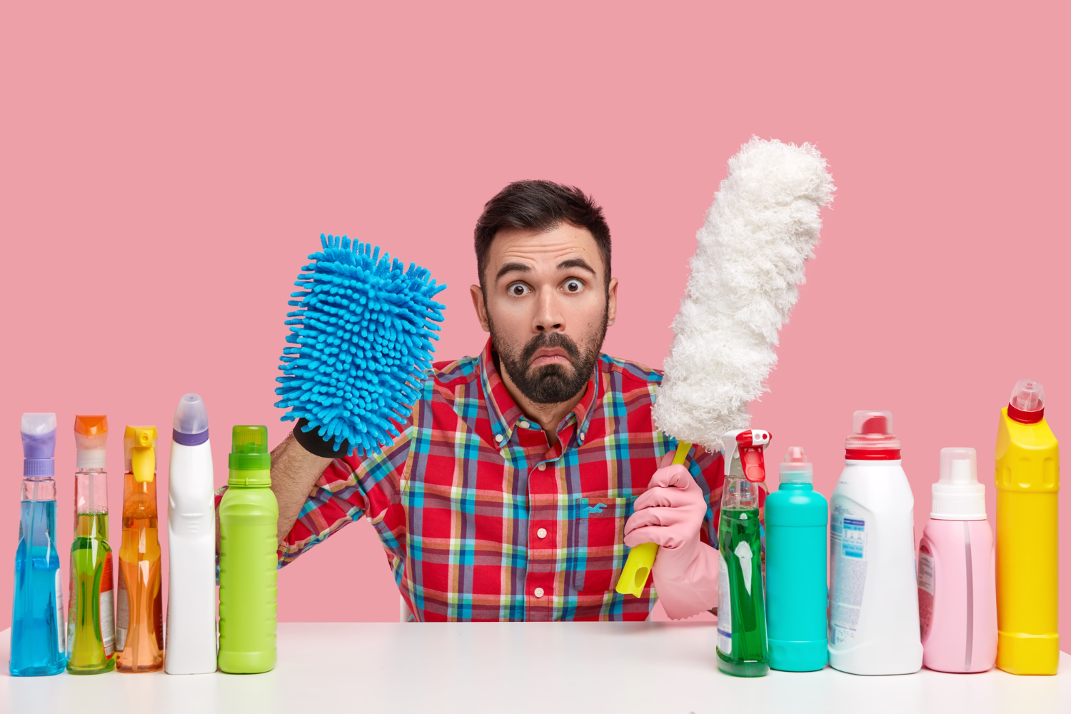 Young Man Sitting Cleaning Products