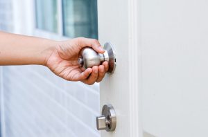 Hand,Opening,Modern,White,Door,With,Chrome,Metal,Handle.,Elements