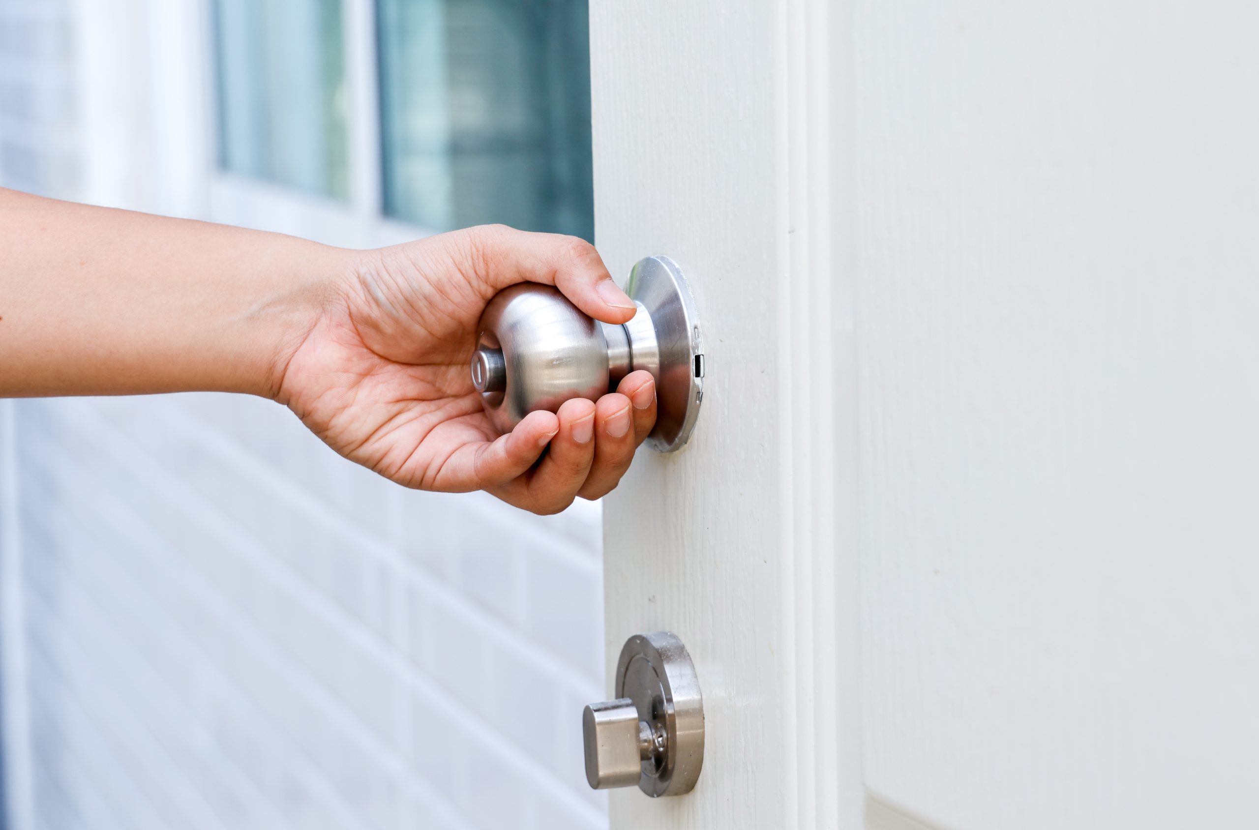 Hand,Opening,Modern,White,Door,With,Chrome,Metal,Handle.,Elements
